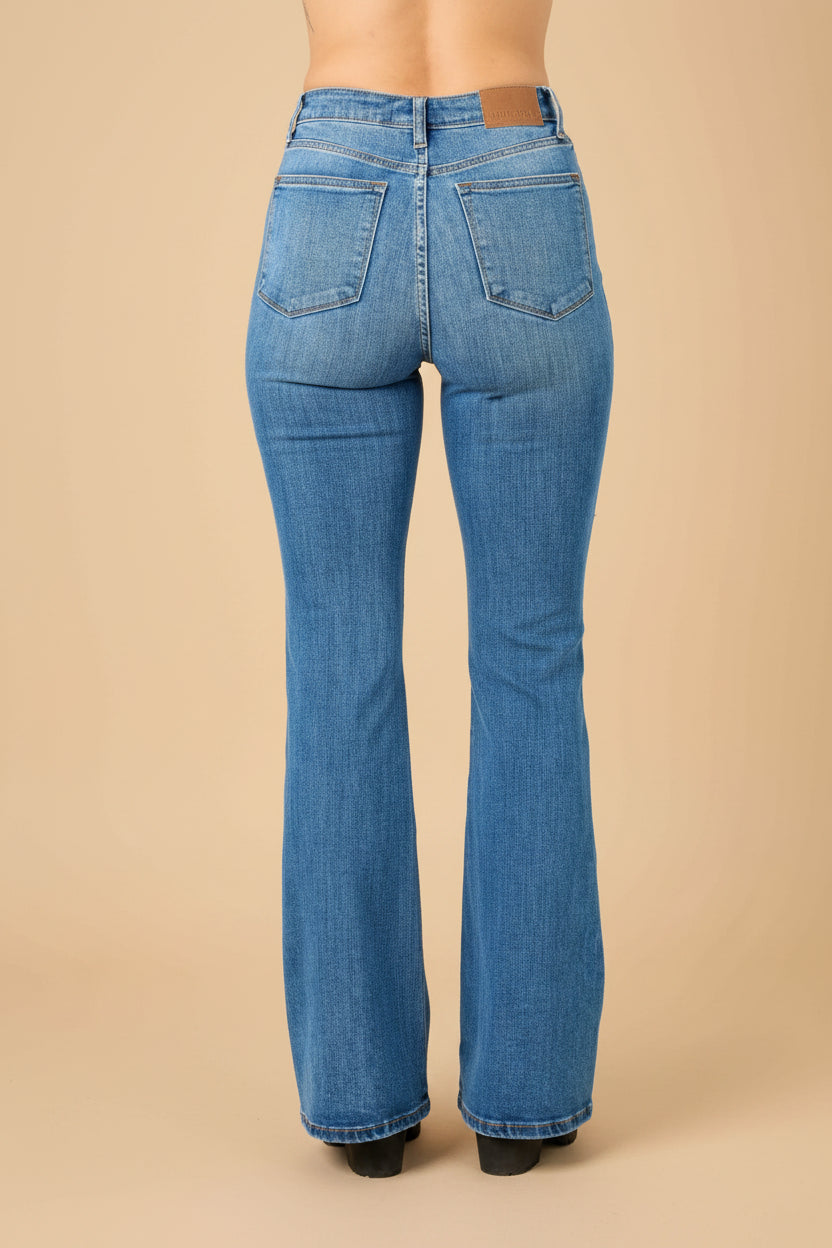 Blue flared jeans on a white background