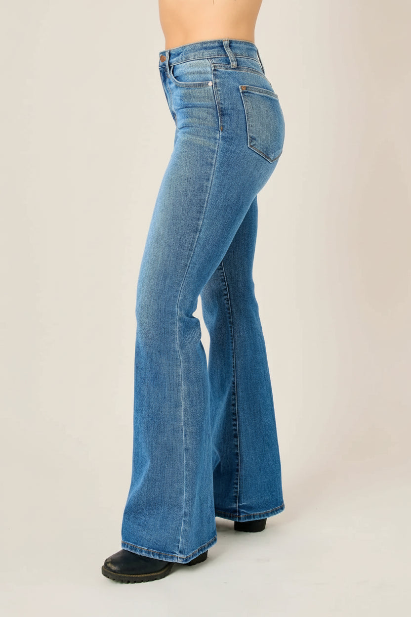 Blue flared jeans on a white background