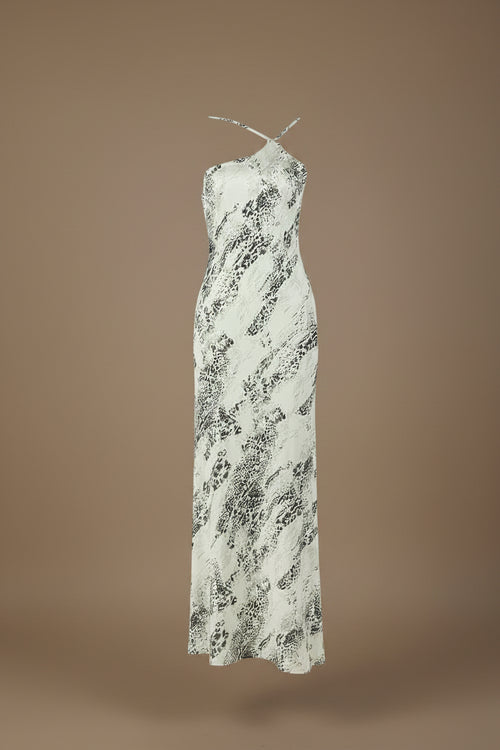 White dress with black pattern on a mannequin against a white background