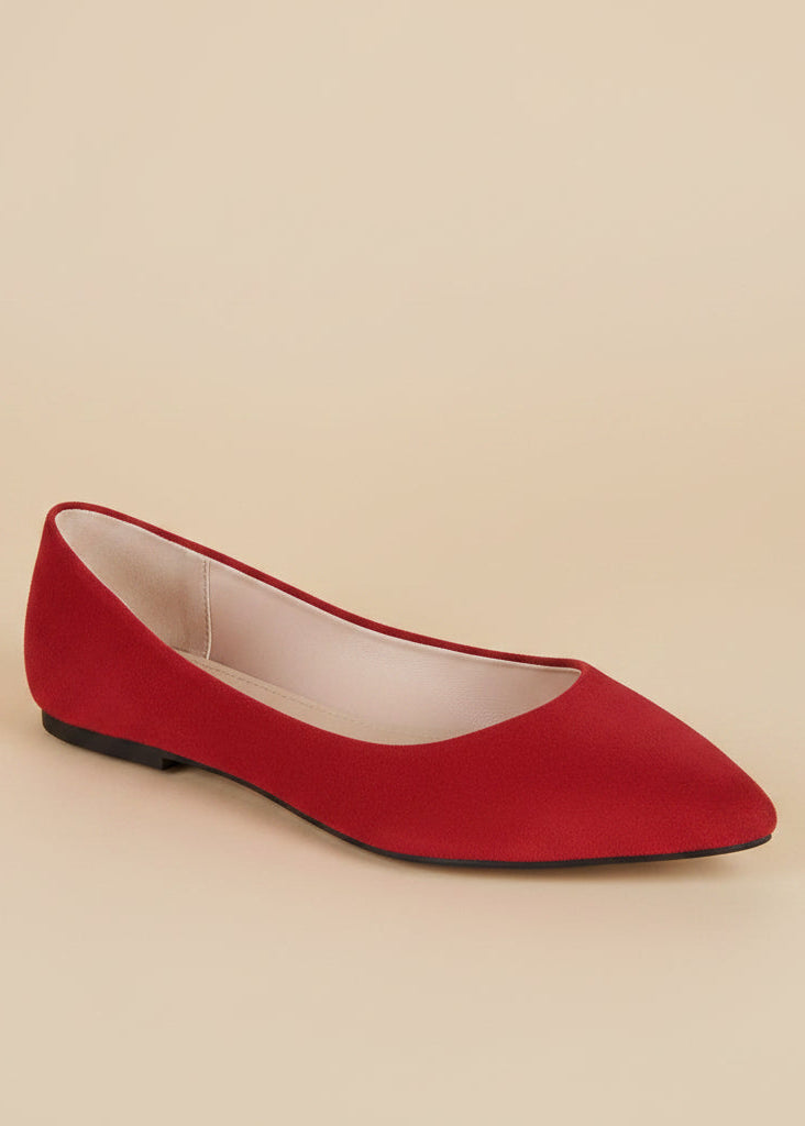 Red flat shoe on a light gray background