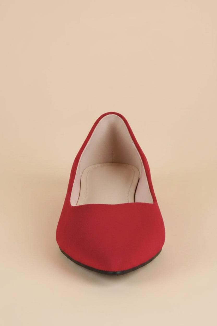 Red flat shoe on a white background