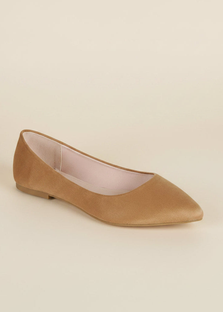 Tan flat shoe on a light gray background
